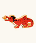Lanka Kade wooden toy dragon figure in red with black horns and tail details, and small orange accents on the mouth flame and feet