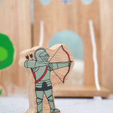 Lanka Kade wooden red armoured knight archer figure with a wooden castle set in the background