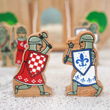 Lanka Kade red foot knight with battle axe wooden figure standing next to a blue knight with morning star weapon fifure