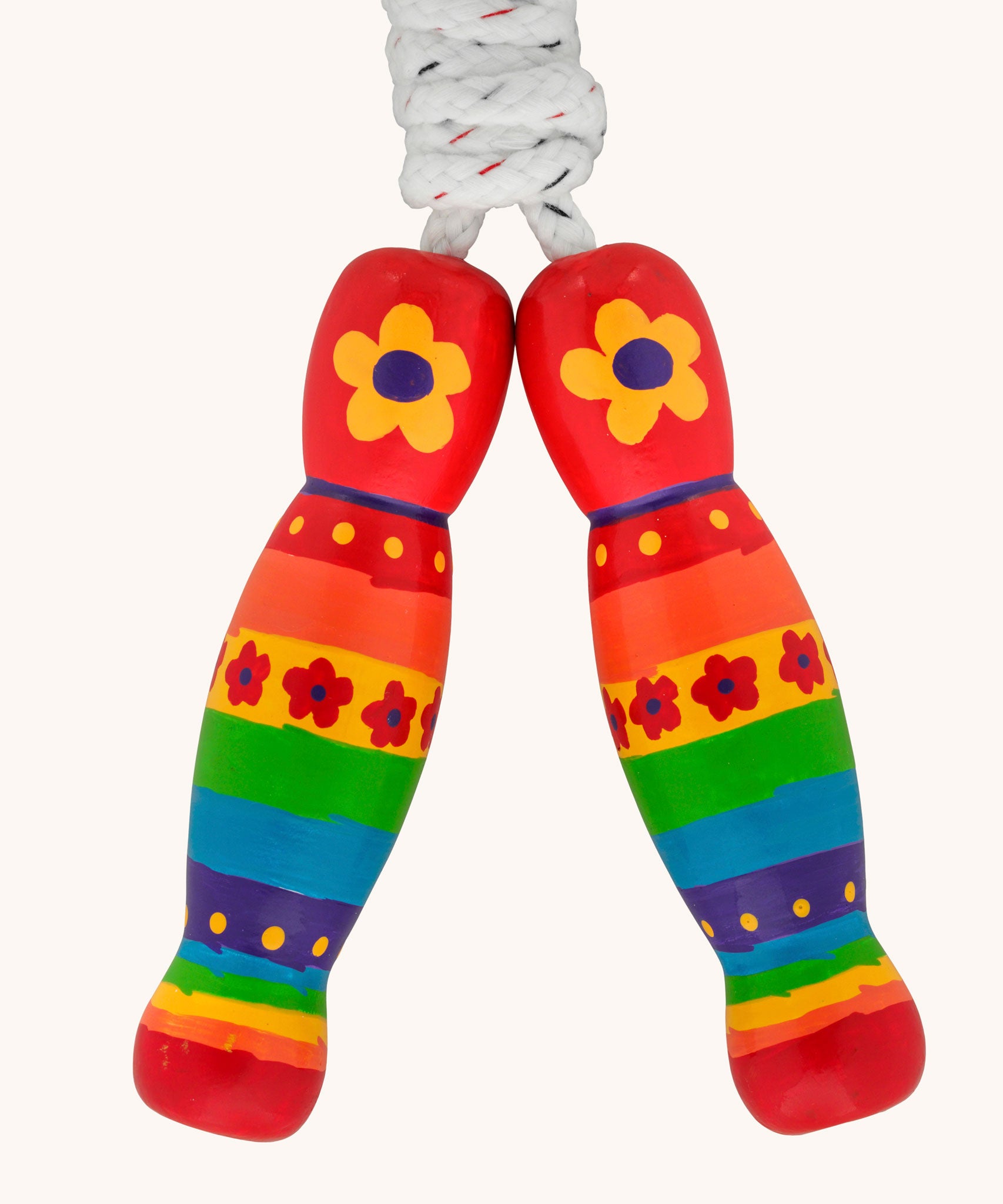 Red rainbow and flowers design Lanka Kade wooden handled children's skipping rope. We are proud stockist of Lanka Kade's range or fair trade wooden toys here at Babipur. 