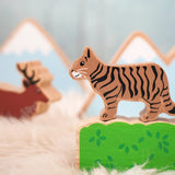 Lanka Kade wooden Scottish wild cat figure standing on a wooden bush with a stag figure in the background