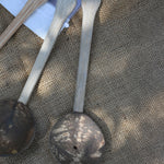A close up of on of the utensils from the Lanka Kade coconut shell utensil set. 