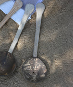 A close up of on of the utensils from the Lanka Kade coconut shell utensil set. 