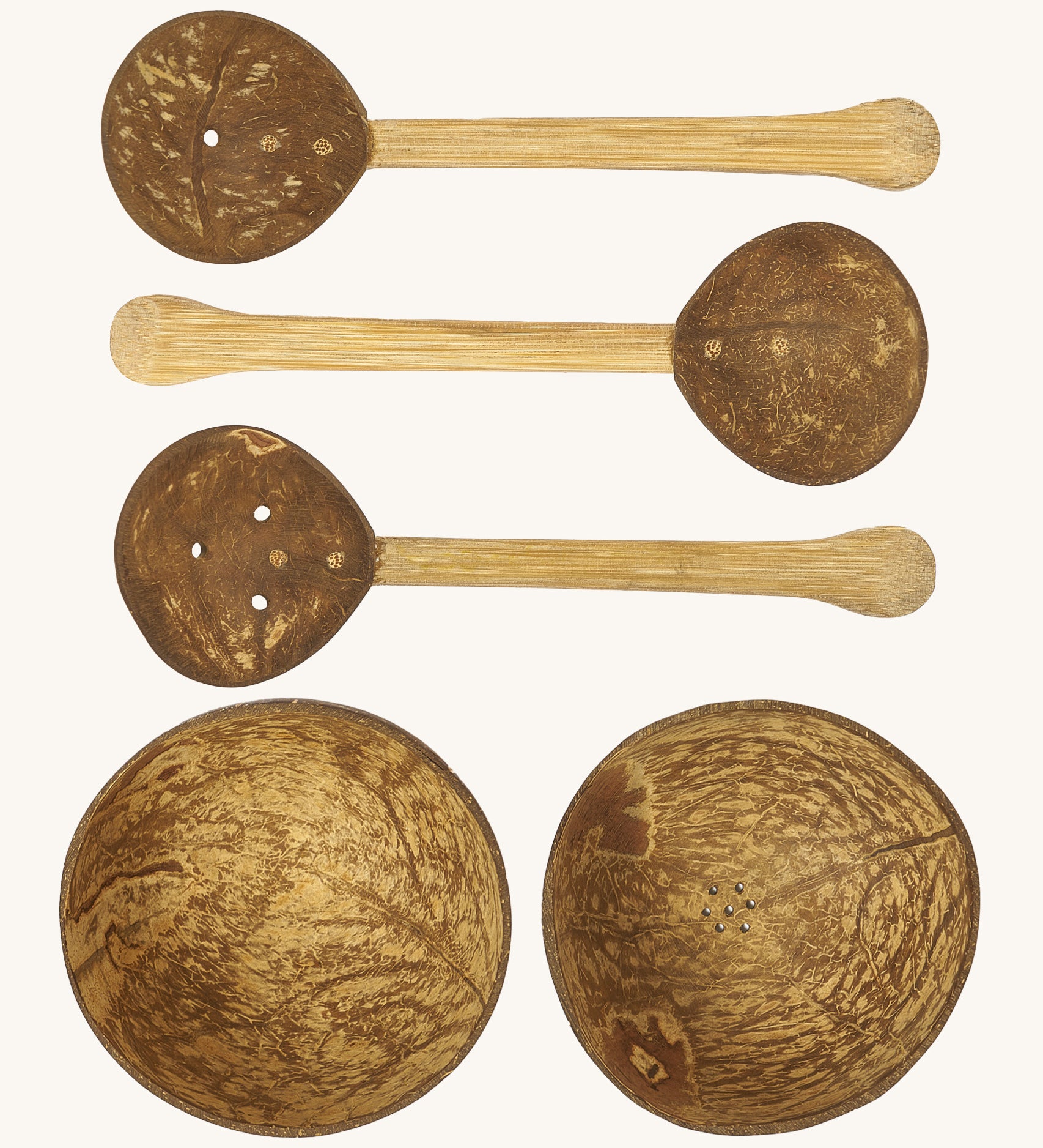 Lanka Kade coconut water play set. Comes with 2 coconut bowls with holes on the bottom and 3 coconut spoons with holes through them.