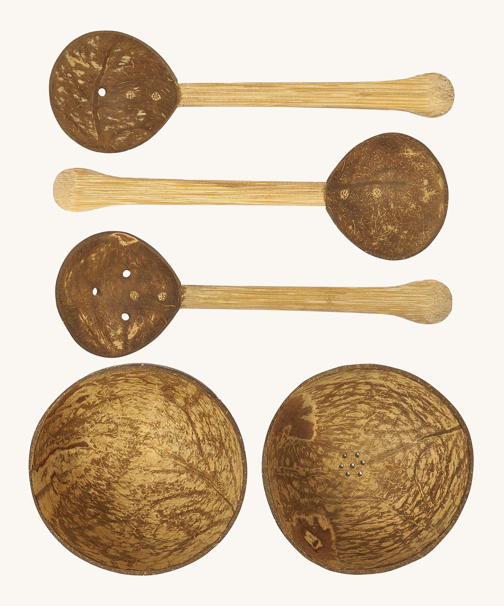 Lanka Kade coconut water play set. Comes with 2 coconut bowls with holes on the bottom and 3 coconut spoons with holes through them.