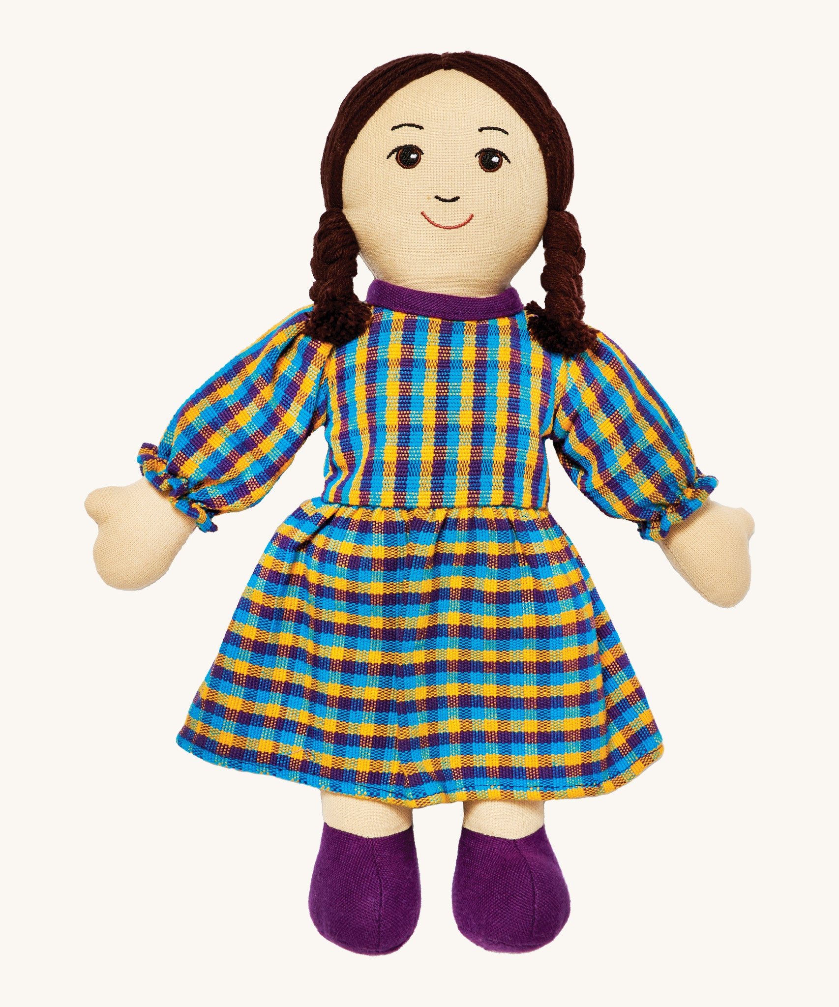 Lanka Kade mum doll with white skin and long black hair. Features a long dress in a multicoloured check style and stitched on shoes. 
