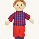 Lanka Kade dad doll with white skin and short blonde hair. Features a short sleeve top in a multicoloured check style, coloured trousers and stitched on shoes. 
