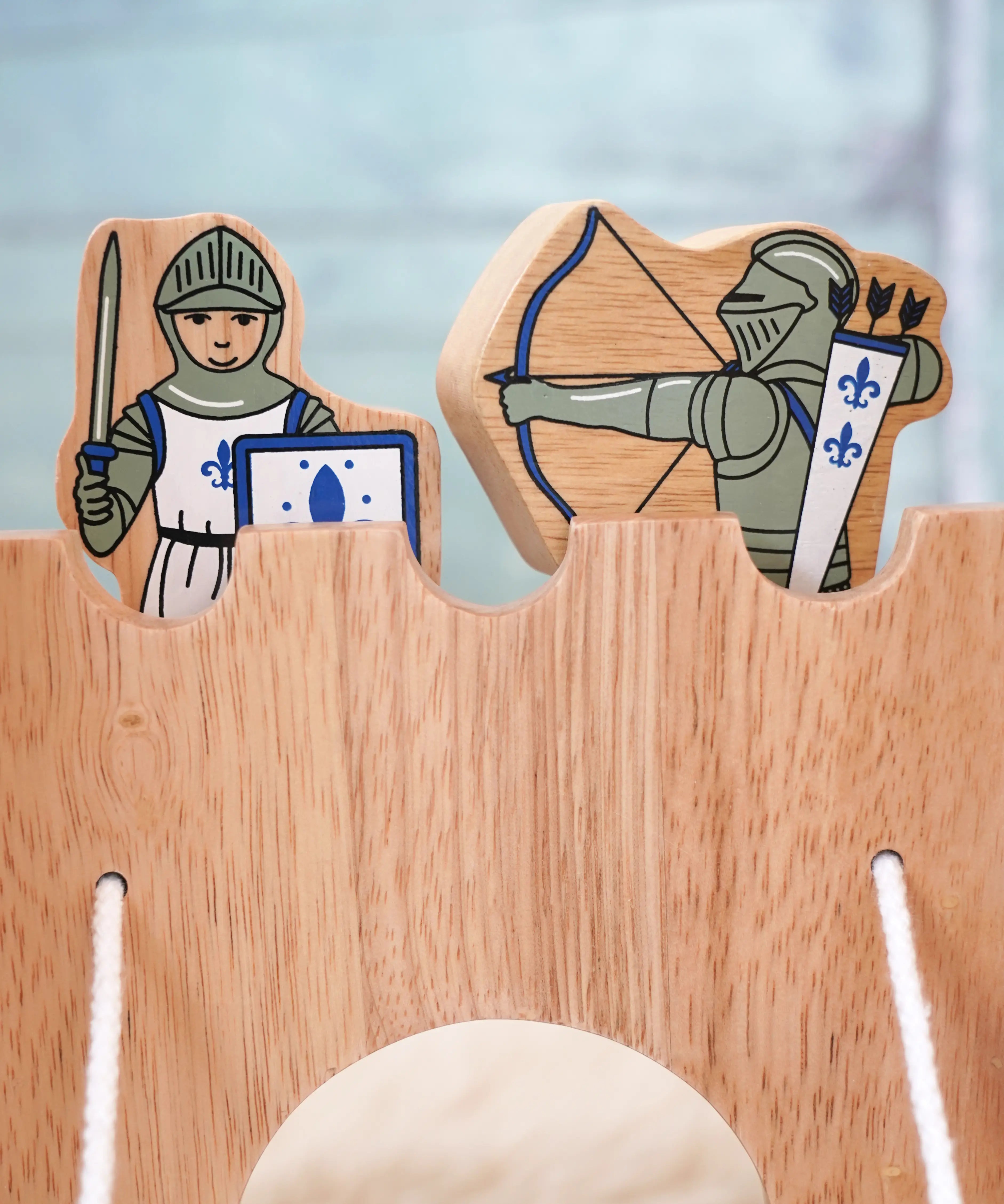 Lanka Kade wooden blue armoured knight archer standing next to a standing knight figure on top of a wooden castle