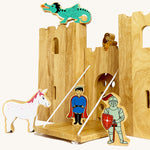 A close up of the drawbridge and lowered gate from the Lanka Kade castle set. Showing the fairytale setup including a dragon, princess, unicorn, prince and knight figure