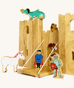 A close up of the drawbridge and lowered gate from the Lanka Kade castle set. Showing the fairytale setup including a dragon, princess, unicorn, prince and knight figure