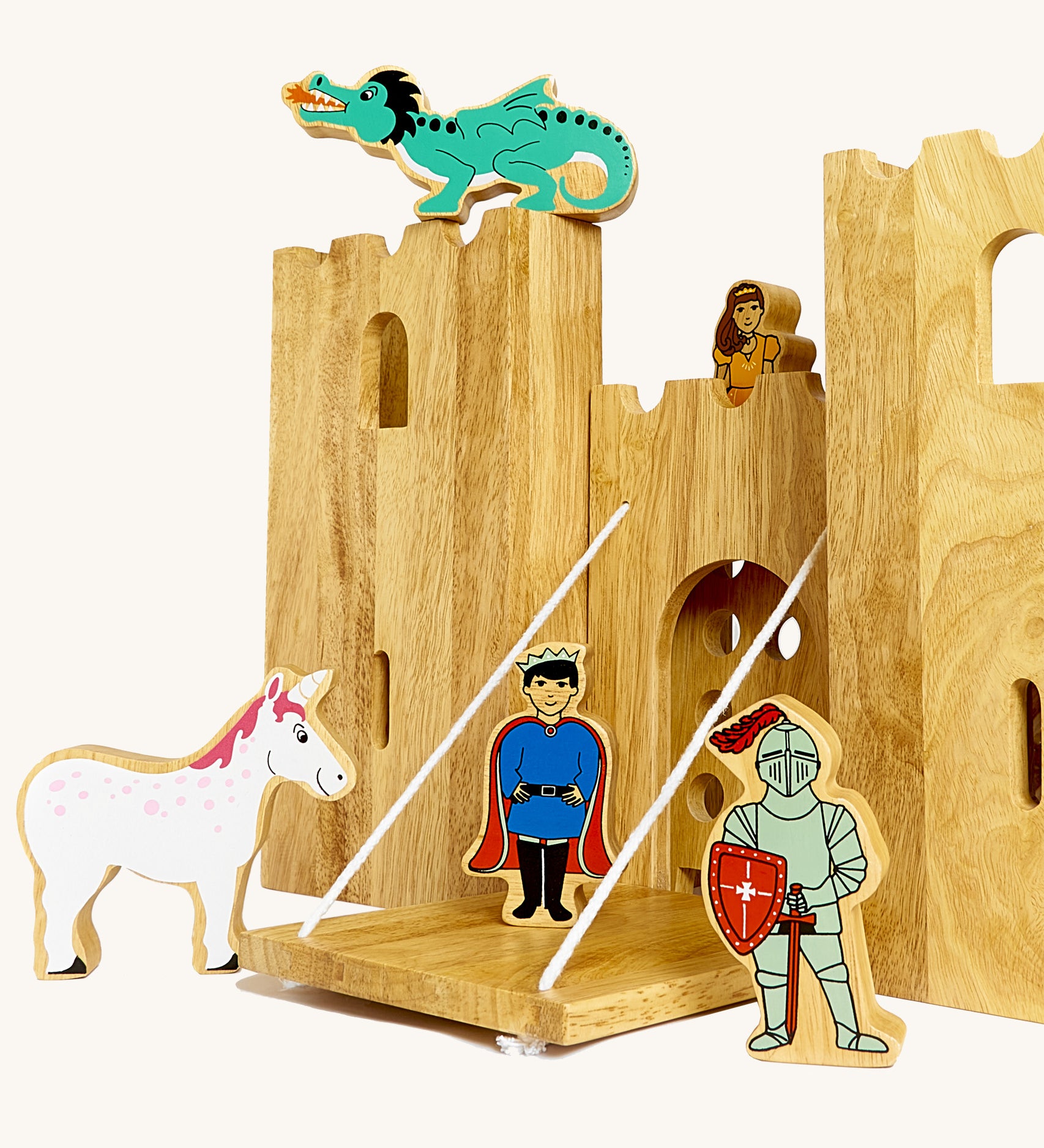 A close up of the drawbridge and lowered gate from the Lanka Kade castle set. Showing the fairytale setup including a dragon, princess, unicorn, prince and knight figure