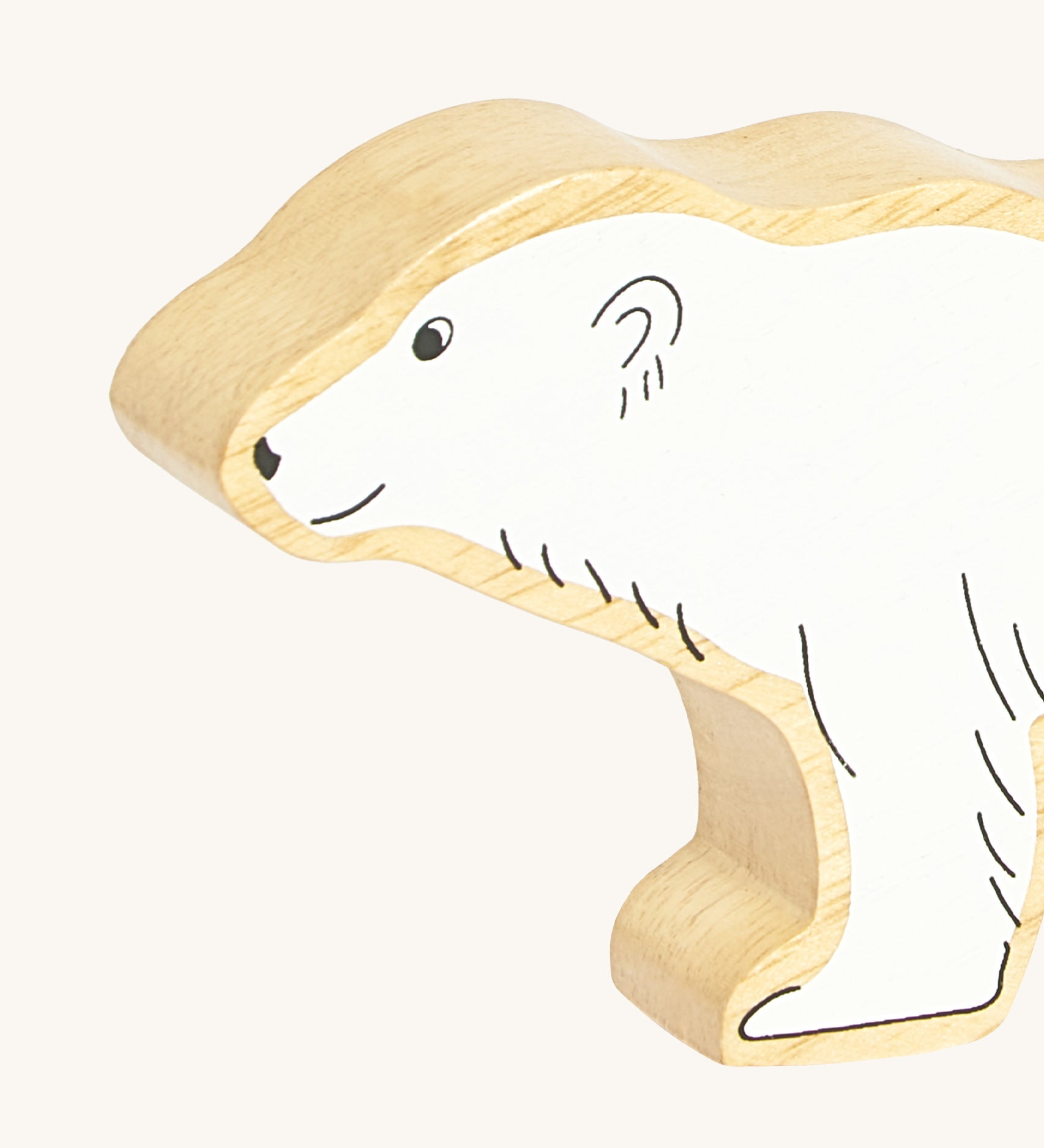 A close up of the chunky wooden Lanka Kade polar bear animal figure showing it's facial features and fur detail. Ths figure is available at Babipur.