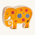 A yellow wooden Lanka Kade elephant with blue and red flowers on a cream background.