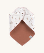 The Lassig goose dribble bib for babies, fastened with poppers at the neck. 