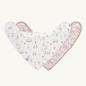 Two Lassig organic dribble bandana bibs, one has a goose pattern and the other has a floral pattern. 