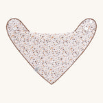 The Lassig baby bandana bib with a floral pattern. 