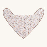 The Lassig baby bandana bib with a floral pattern. 