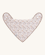 The Lassig baby bandana bib with a floral pattern. 