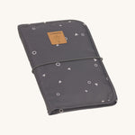 The Lassig recycled polyester baby change pouch in a dark anthracite grey.