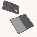 The Lassig recycled polyester baby change pouch in a dark anthracite grey, and the change mat that comes with it.
