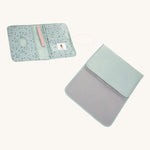The Lassig baby changing pouch made from 100% recycled polyester, in a floral mint green pattern., with the matching baby change mat.