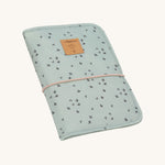 The Lassig baby changing pouch made from 100% recycled polyester, in a floral mint green pattern.