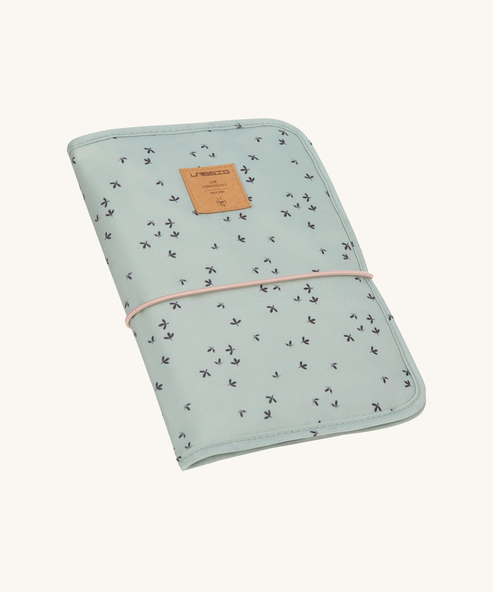 The Lassig baby changing pouch made from 100% recycled polyester, in a floral mint green pattern.