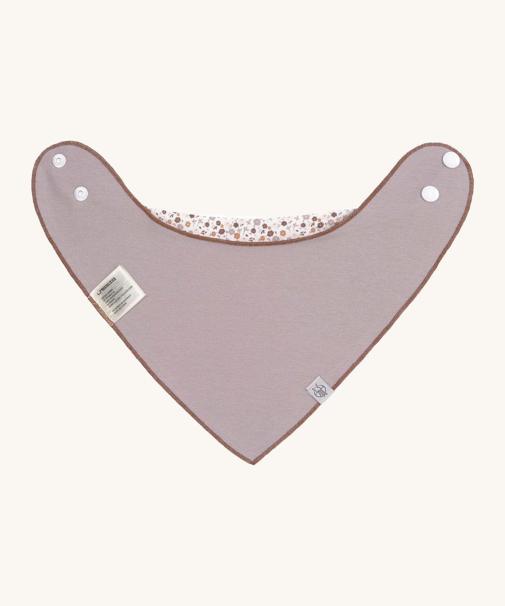 The reverse side of the organic cotton bandana bib from Lassig, in a soft grey / lilac.