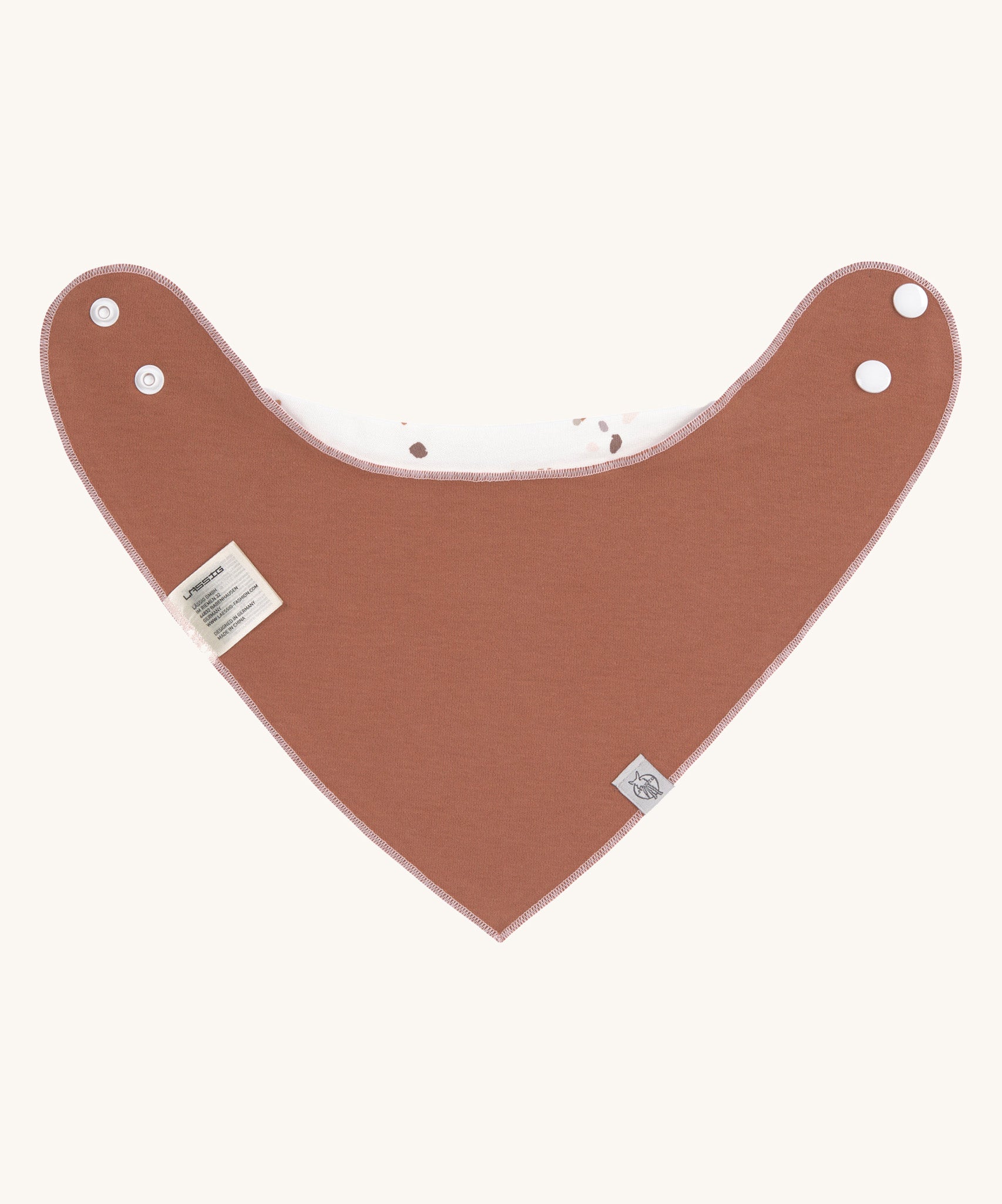 The reverse side of the Lassig organic cotton bandana bib, in a lovely orange rust colour. 