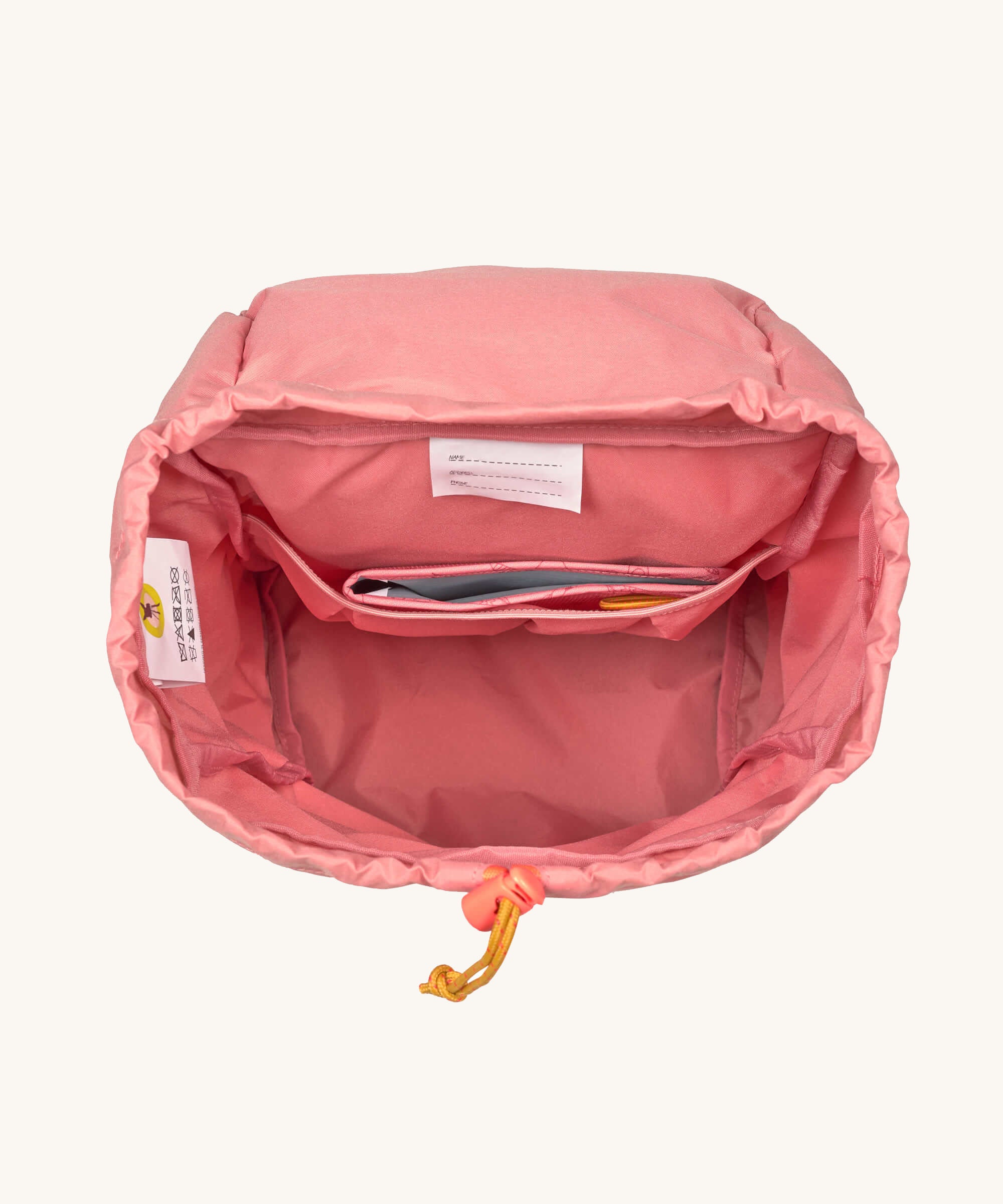 A top down view showing the interior of the Lassig Kids Big Outdoor Backpack with an Adventure rose pink design. The print features tents, trees, and clouds, and a pink front strap. These children's backpacks are part of a wide range available at Babipur.