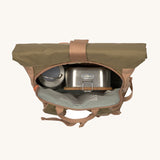 The Lassig Mini Rolltop Backpack in a Nature Hazelnut colour shown with a stainless steel lunchbox and bottle inside. This children's bag is part of a wide range of backpacks and accessories available at Babipur. 