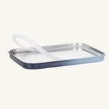 The lid and silicone seal from the  Lassig Stainless Steel Lunchbox with a Unique Dark Blue lid. This lunch box has a removable divider. 