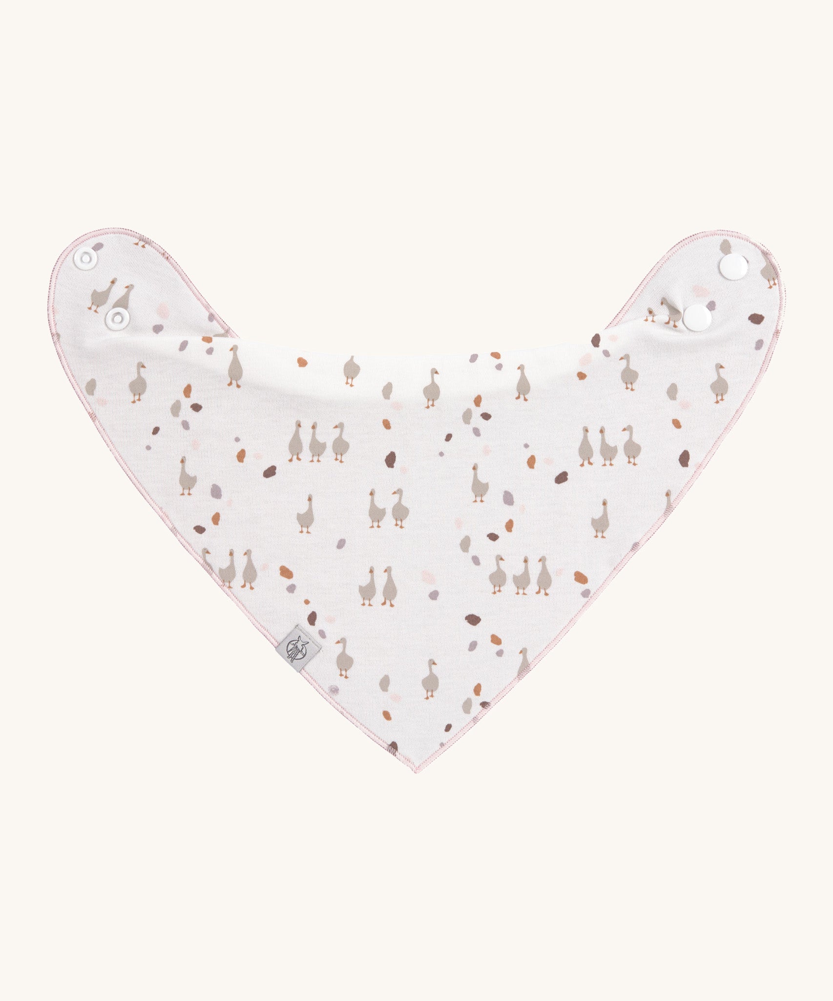 A Lassig organic cotton baby dribble bib, in white with little geese all over.