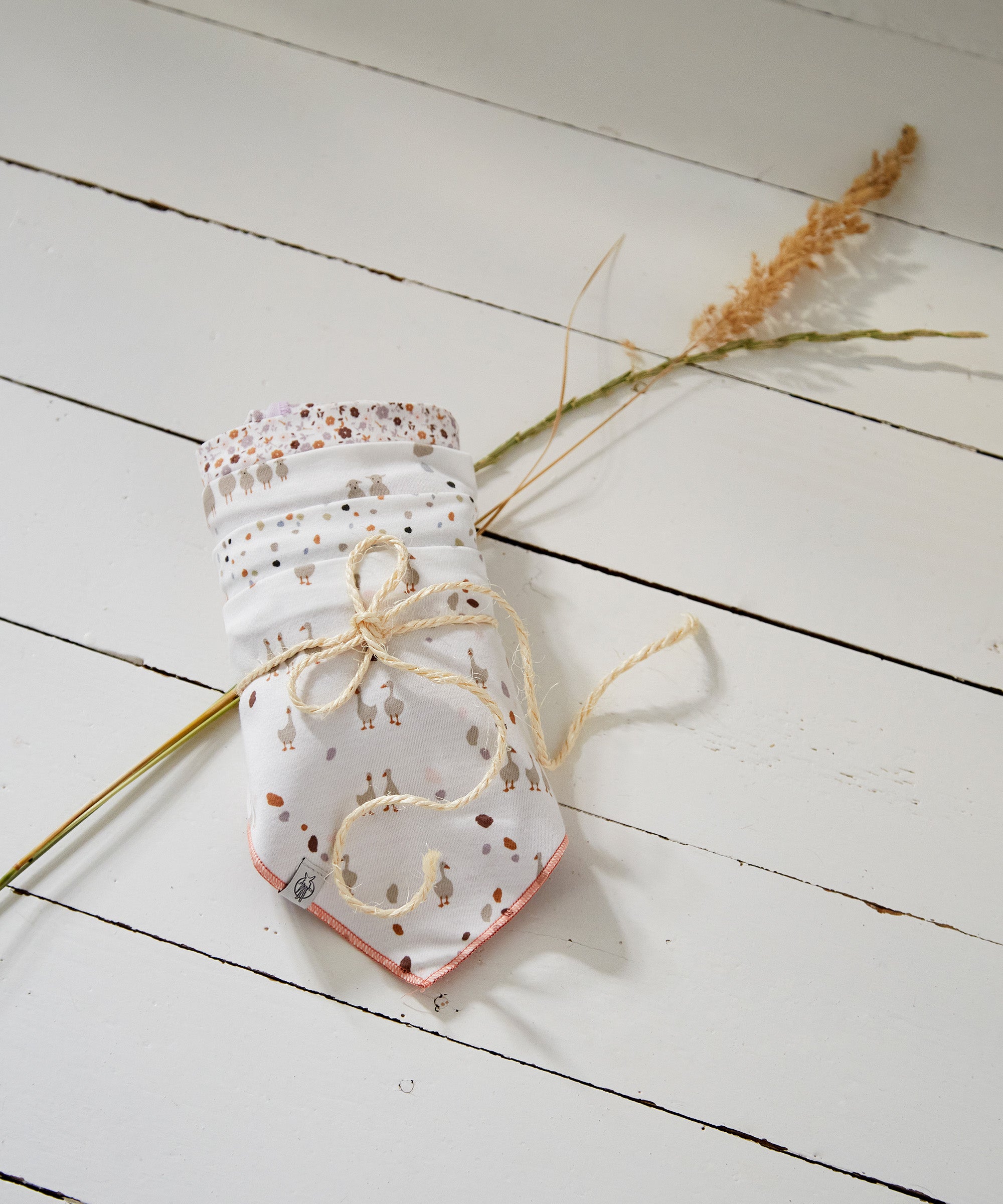 The 2 pack of Lassig organic baby dribble bibs in the Tiny Farmer Goose print.