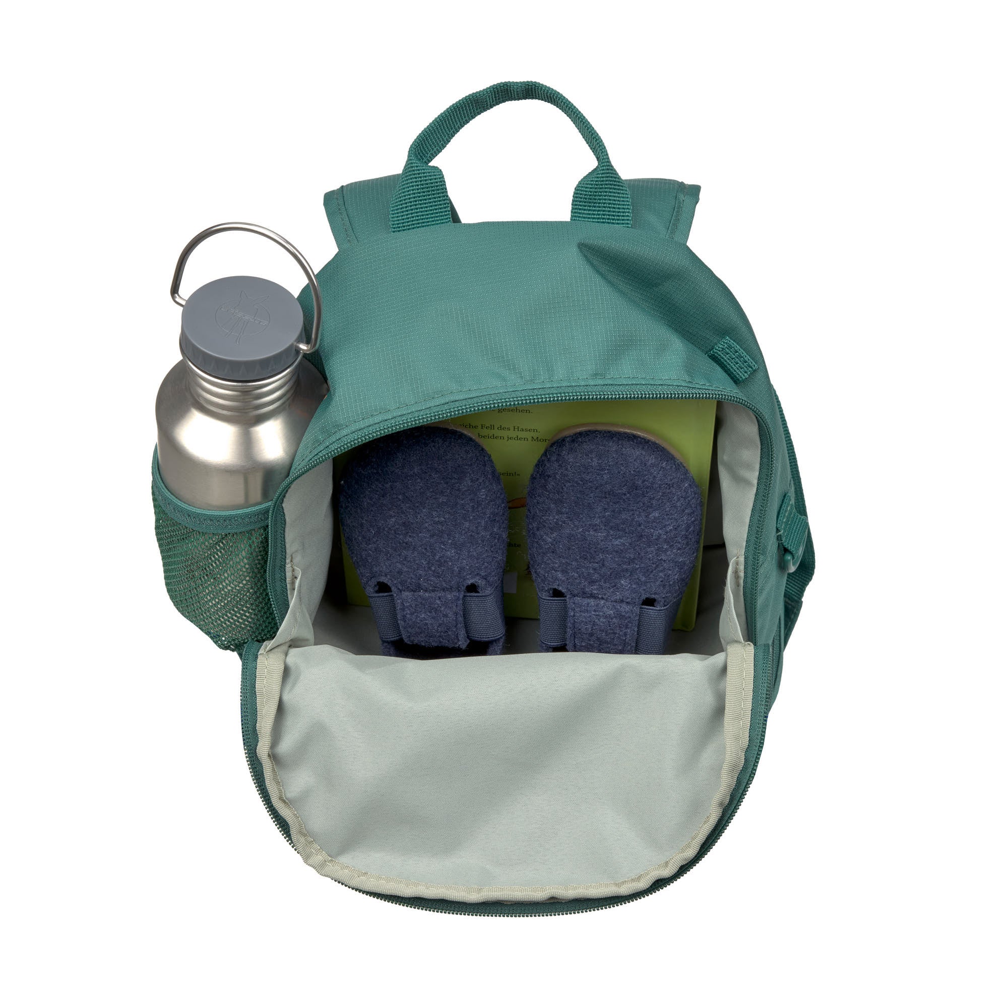 A top view of an opened Lassig mini backpack for kids in a dark green colour, to show how you can use it to store shoes, books, and a water bottle. 