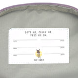 The inside label of the Lassig mini kids backpack with multiple spaces for names and phone numbers. 