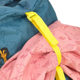 The Lassig kids big outdoor backpack in Adventure Blue, with a coat secured under the front strap. These children's backpacks are part of a wide range available at Babipur.