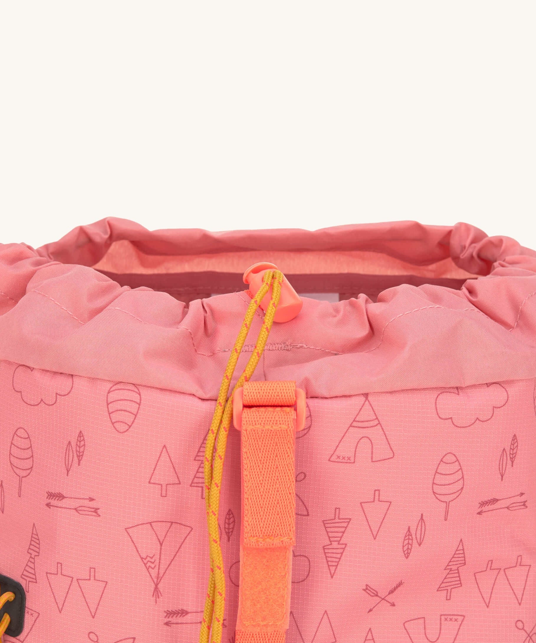 A close up of the toggle closure on the Lassig Kids Big Outdoor Backpack with an Adventure rose pink design. The print features tents, trees, and clouds, and a pink front strap. These children's backpacks are part of a wide range available at Babipur.