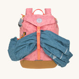 The Lassig kids big outdoor backpack in Adventure rose, with a coat secured under the front strap. These children's backpacks are part of a wide range available at Babipur.