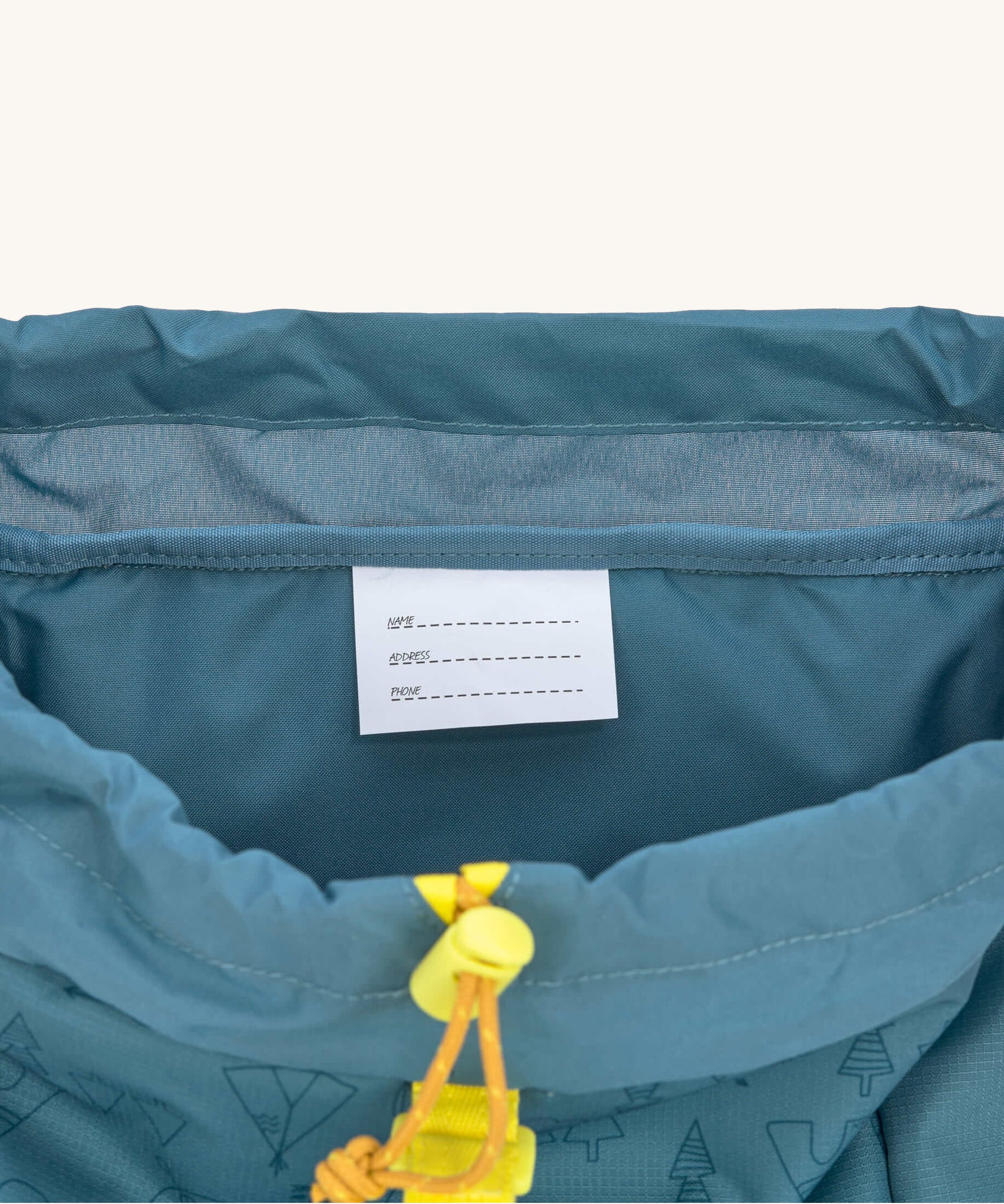 A close up of the name tag inside the  Lassig Kids Big Outdoor Backpack.