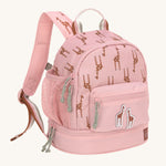 A Lassig mini backpack for kids in light pink, with giraffes printed all over.