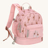 A Lassig mini backpack for kids in light pink, with giraffes printed all over.