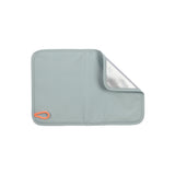 The thermo-insulated sitting pad that comes with the Lassig kids mini outdoor backpack in blue.