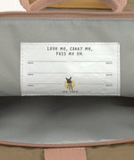 A close up of the name tags inside the Lassig Mini Rolltop Backpack in a Nature Hazelnut colour. This children's bag is part of a wide range of backpacks and accessories available at Babipur. 
