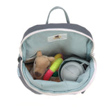 A top view of the Lassig tiny kids backpack in grey, with a toy, a cuddly animal, and a water bottle inside. 