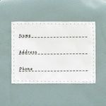 The inside label of the Lassig 'About Friends' tiny backpack in light pink.