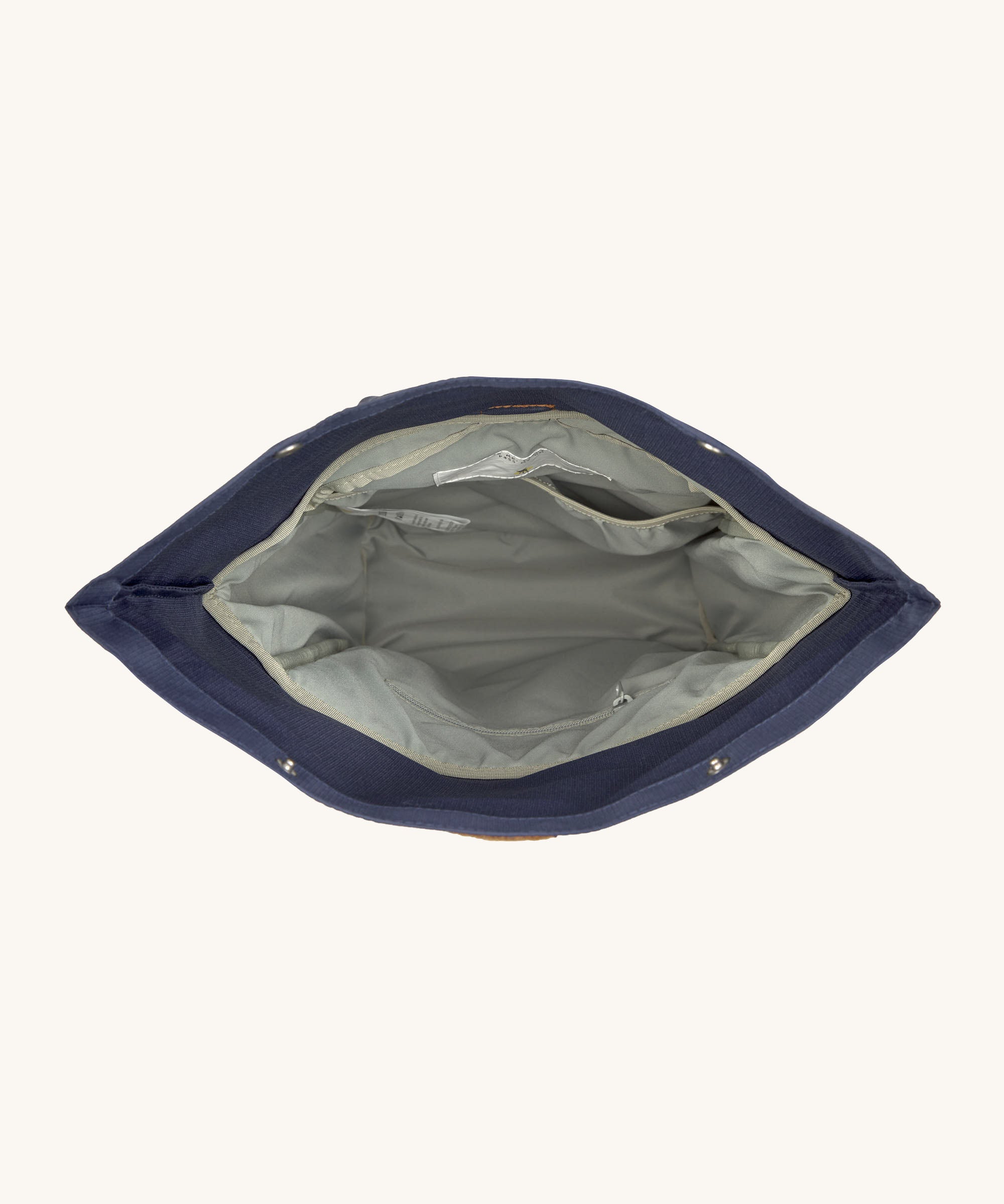 The Lassig Medium Rolltop Backpack in a Little Gang Navy colour design shown with the top open. These roll top bags are available in different colours and sizes at Babipur.