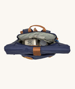 A view of the inside of the Lassig Medium Rolltop Backpack in a Little Gang Navy colour design. These roll top bags are available in different colours and sizes at Babipur.