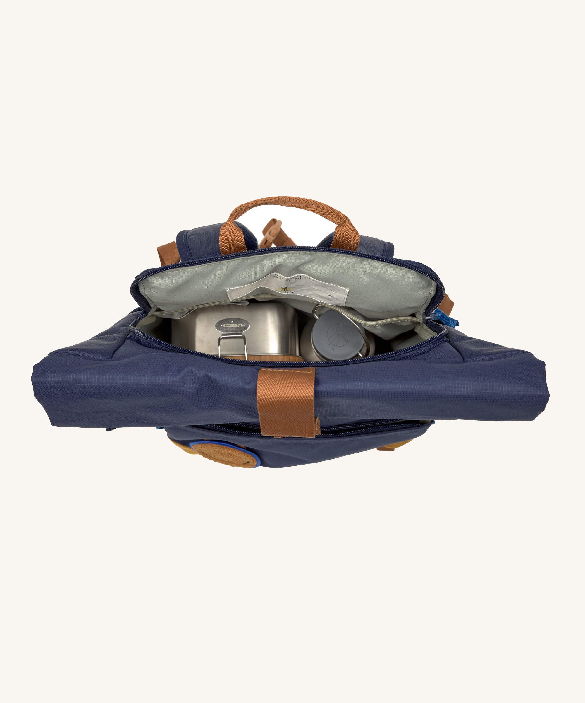 A view of the inside of the Lassig Medium Rolltop Backpack in a Little Gang Navy colour design. These roll top bags are available in different colours and sizes at Babipur.