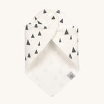 The Lassig organic cotton bandana bib in white with grey triangles, wrapped around and fastened with the popper fastenings. 